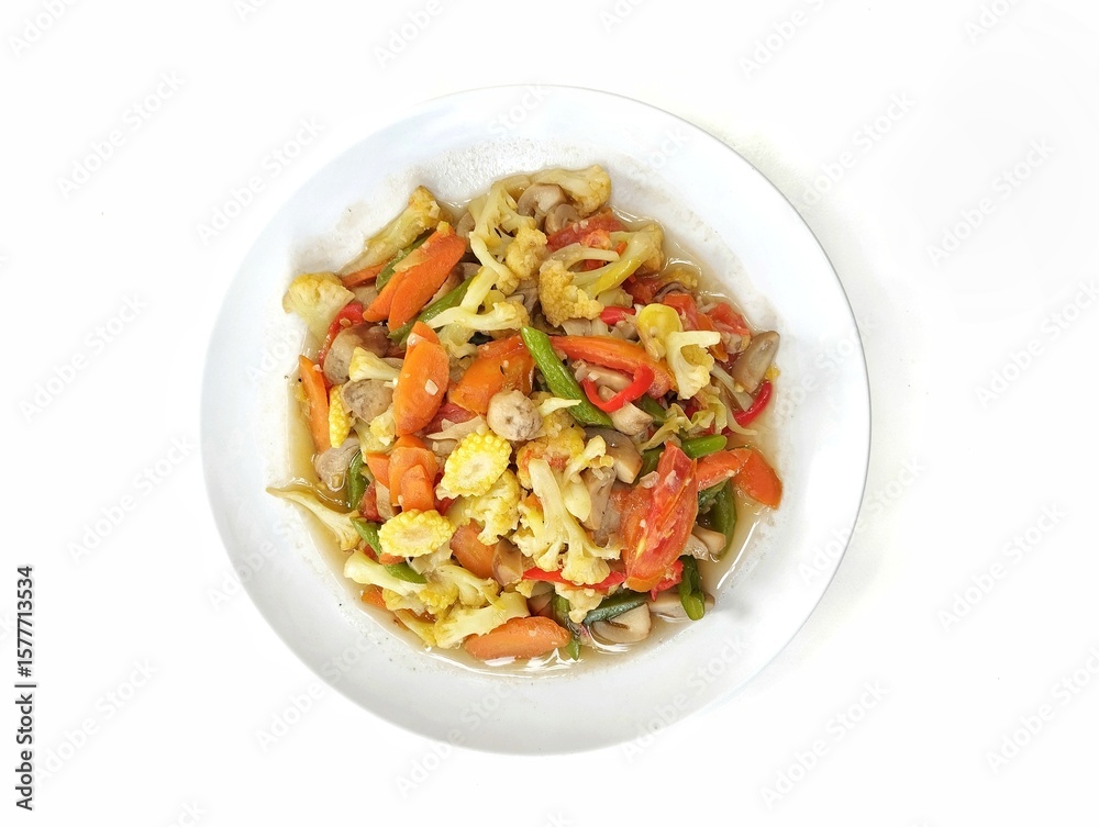 Capcay or Indonesian food made from various vegetables cooked stir-frying. Isolated on white background, Flat lay Capcay or Indonesian food made from various vegetables cooked stir-frying. Isolated on white background, Flat lay