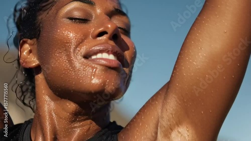 Fitness, tired and black woman wipe sweat for health, wellness or exhausted by blue sky. Runner, fatigue and space on break outdoor for intense exercise, breathing or rest for recovery with low angle