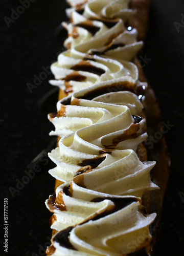 fresh bakede rolled homemade cake on a black plate