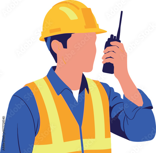 A construction worker with a yellow helmet holding a walkie talkie