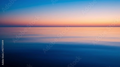 Vibrant Sunset Over Calm Ocean Waters Displaying Blue Orange and Pink Colors