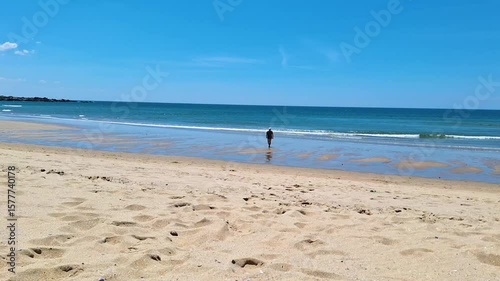 woman walking on Matosinhos beach in Portugal