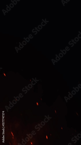 red fire sparks with black background in vertical video format