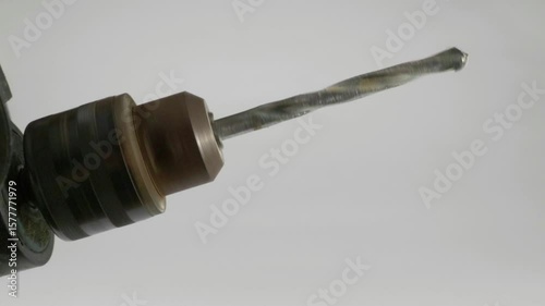 This is a detailed closeup view of a Drill Bit that is currently in action during use