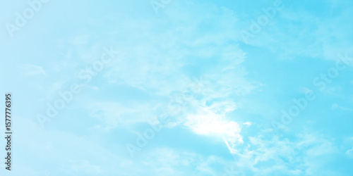 Blue sky, sun, clouds. A peaceful moment with underlying complexity. A reflection of the sky on thin clouds. Hidden emotions beneath a bright exterior like feeling melancholic on a good day background