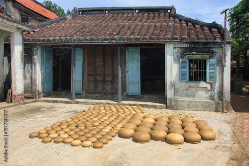 Ceramic products are dried in the sun in the courtyards of the ancient Thanh Ha pottery village, Hoi An, Vietnam.