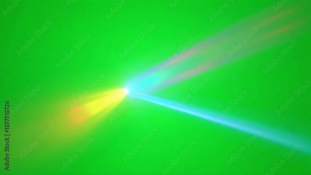 Bright streaks of light and color dance across a vibrant green screen, creating a dynamic visual effect.
