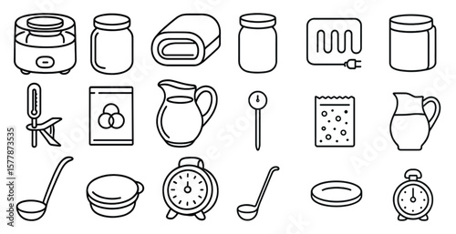 Collection of kitchen utensils and appliances, including a clock, a spoon, and a bowl