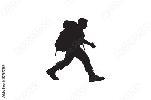 Silhouette of a Man Hiking with a Backpack Walking Outdoors