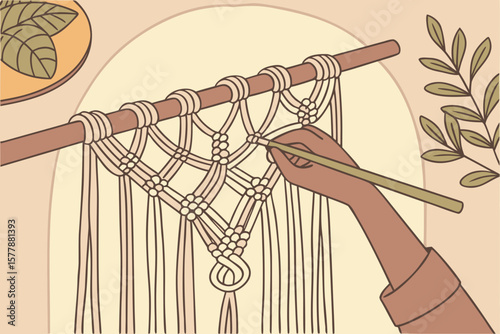 Close up of hand crafting a macrame wall hanging with leaves and a wooden dowel rod shown too