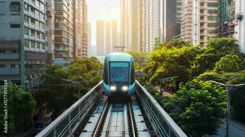 Elevated train in urban setting with lush green vegetation