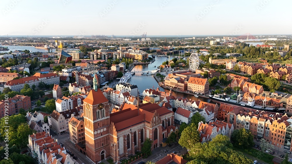 Obraz premium Aerial photo taken by drone over the historic tourist center of Gdansk, the city hall and the cathedral on a summer day, Poland, Europe