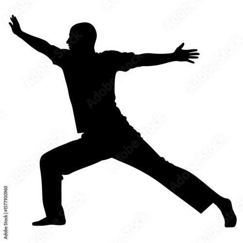 Man performing a dynamic yoga pose in silhouette style  
