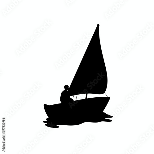 Silhouette of a man sailing on a boat with a large sail  