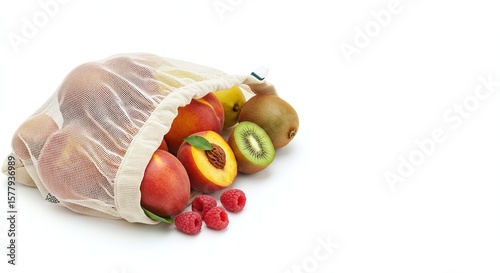 Assorted Fresh Fruits Pouring Out of Reusable Mesh Bag on White Background