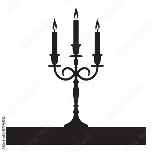 A silhouette of a candelabra with three lit candles
