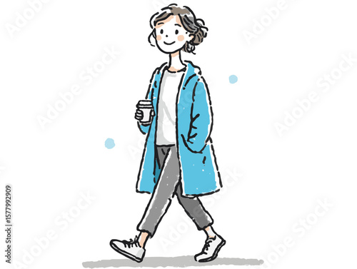 Smiling young woman in a blue coat enjoying coffee while walking cheerfully against a simple white background, lifestyle concept of cafes or coffee shops