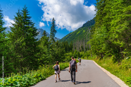 Fototapeta Naklejka Na Ścianę i Meble -  People walking on the trail to Morskie Oko in Tatra National Park in southern Poland