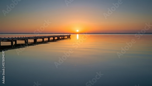 Wallpaper Mural Serene Pier Reflects Golden Sunrise Over Calm Water Torontodigital.ca