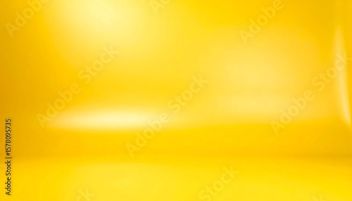 Empty, bright yellow studio backdrop with soft gradients