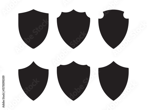 Collection of six black shield silhouettes isolated on white background