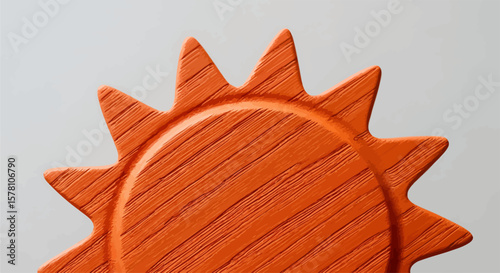 Close-up of a vibrant orange, sun-shaped wooden object with a textured surface.