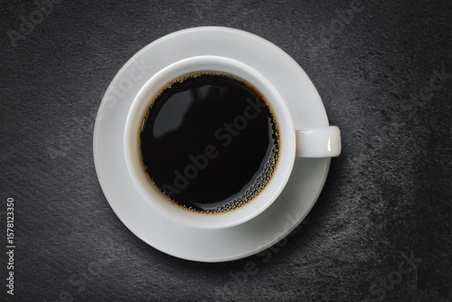 Top view, Freshly brewed black coffee in white cup on a dark background. The concept of drinking black coffee for good health. For copy space. Generated image