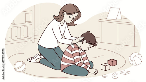 Caring mother comforts her sad son who is sitting on the floor with toys