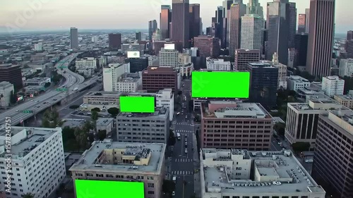 Aerial View of Downtown Los Angeles with Skyscrapers, Highways, and Green Screen Billboards for Chroma Key Advertising Mockups
