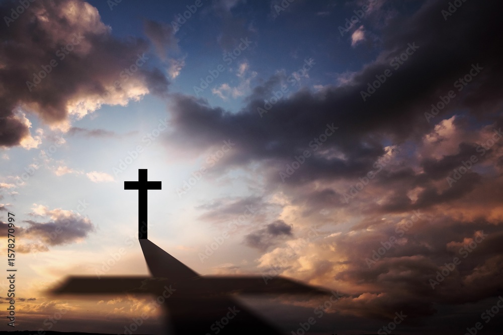 Obraz premium Flat illustration showing cross silhouette atop hill casting long shadow under sunset clouds