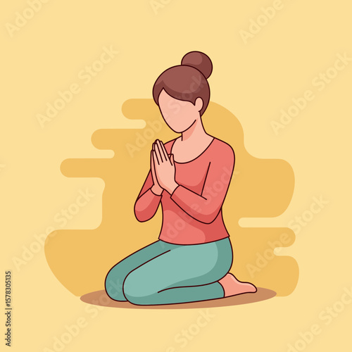 Woman kneeling in prayer with hands clasped against a yellow backdrop