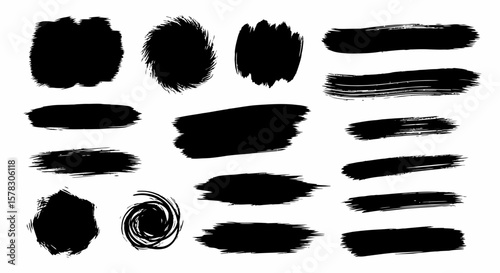 Artistic collection of black brush strokes and splatters for creative design projects