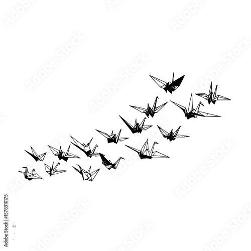 A collection of origami paper cranes in black and white flying diagonally across a white background scene