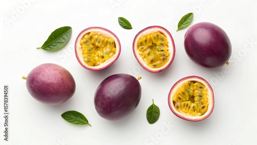 Fresh Passion Fruit Halves and Whole Fruits with Green Leaves on White