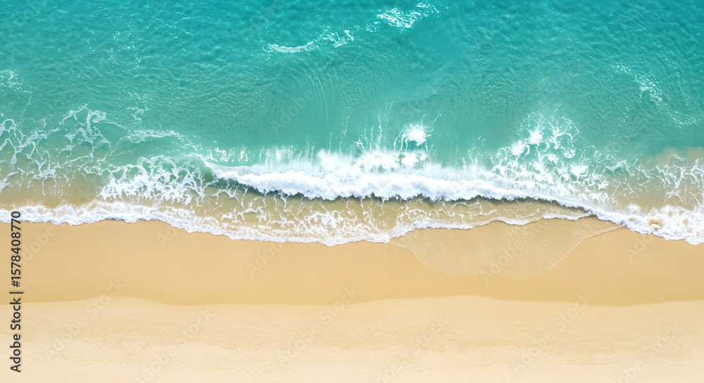 Obraz premium Aerial View of Turquoise Ocean Waves Crashing on Golden Sandy Beach