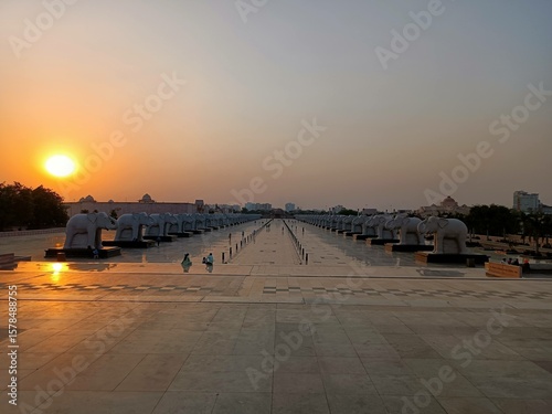 Sunset over Ambedkar Memorial Park with Elephant Statues and Long Pathway