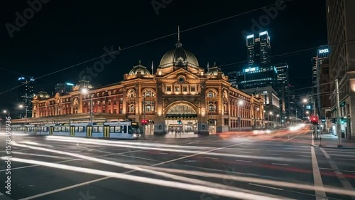 Melbourne Flinders Street Station at Night: City Lights and Tram Trails.