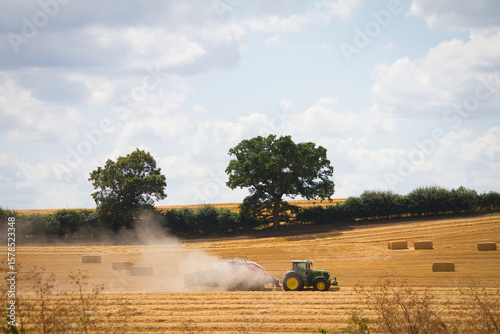 Tractor cutting grass/hay in the countryside