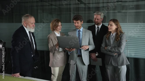 Business meeting - manager discussing work with his colleagues