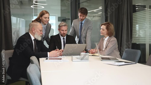 Business team discussing together business plans in office