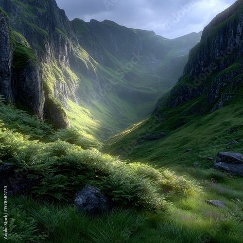 Sunlit green valley with steep rugged mountain slopes and lush vegetation