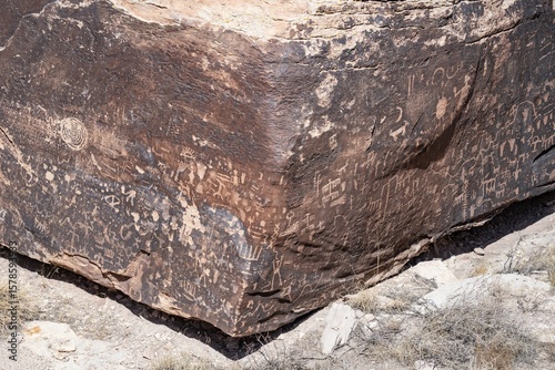 Newspaper Rock Petroglyphs Archeological District, Petrified Forest National Park, Arizona. Desert varnish. Chinle Formation, Blue Mesa Member. Mudstone with minor siltstone and sandstone.