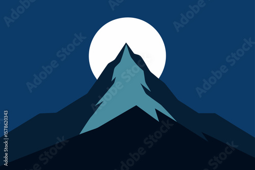 mountain peak silhouetted against full moon