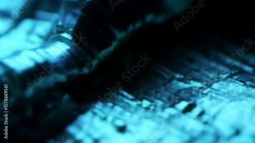 Close up abstract macro footage of a textured surface with changing colorful lights