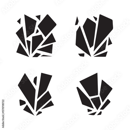Four abstract black geometric shapes resembling shattered glass or crystals on white background