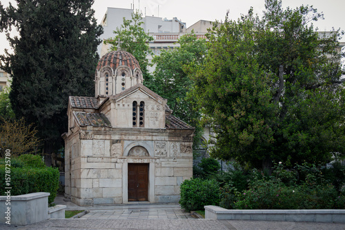 Fototapeta Naklejka Na Ścianę i Meble -  A small, Greek Othordox church, located amoungst the narrow streets of Athens, Greece, early in the morning