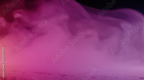 Mesmerizing Abstract Smoke in Pink and Purple Hues Moving Against a Black Background