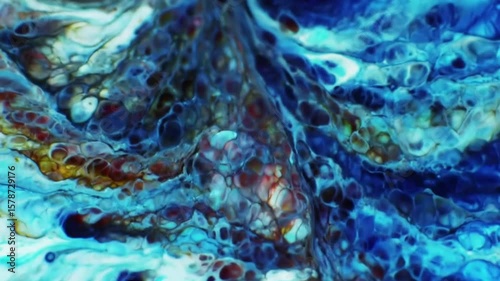 Mesmerizing CloseUp of Abstract Fluid Art with Swirling Blue and Teal Colors