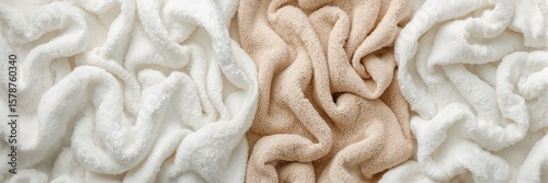 white and beige towels, with each towel's texture and creases prominently showcased
