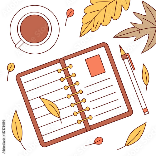 Open notebook with lines and a leaf inside next to a pen and a cup surrounded by autumn leaves